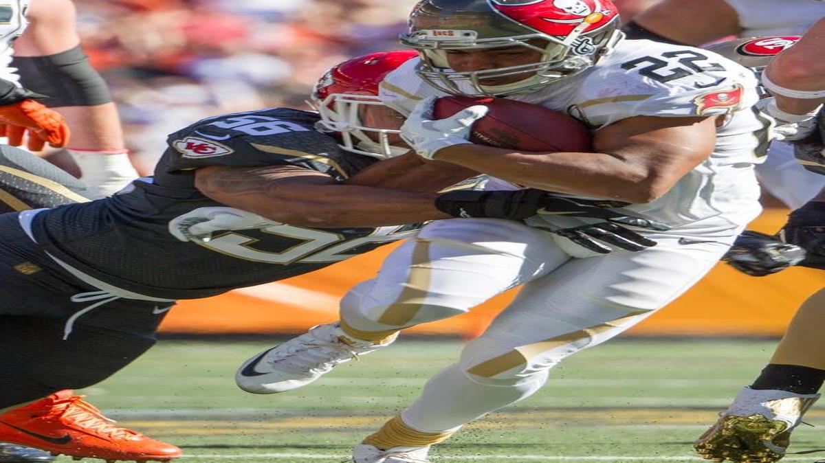 Tampa Bay Buccaneers running back Doug Martin (22) of Team Rice bounces off Kansas City Chiefs inside linebacker Derrick Johnson (56) of Team Irvin in the second quarter of the NFL Pro Bowl football game, Sunday, Jan. 31, 2016, in Honolulu.