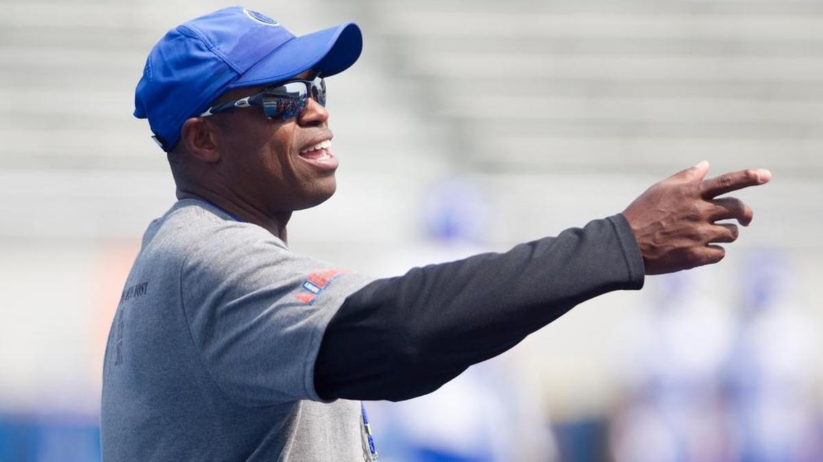 Cornerback coach Ashley Ambrose instructs players during Boise State football practice at Albertsons Stadium on Aug. 9, 2017.