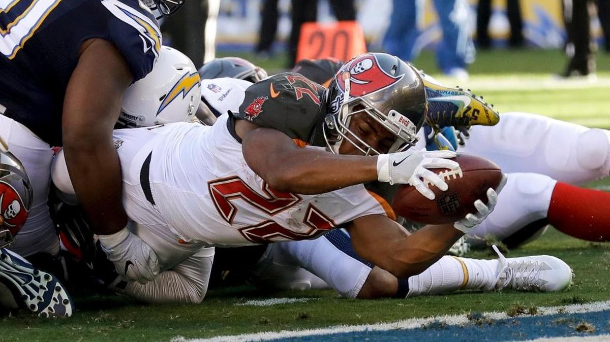 Tampa Bay Buccaneers running back Doug Martin scores during the first half of an NFL football game against the San Diego Chargers, Sunday, Dec. 4, 2016, in San Diego.