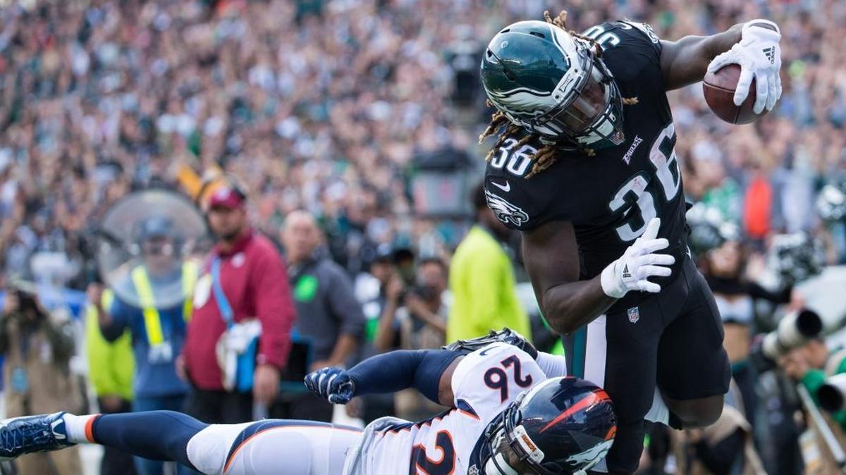 Philadelphia Eagles running back Jay Ajayi leaps into the end zone to score a touchdown over Denver Broncos free safety Darian Stewart during NFL action Nov. 5 at Lincoln Financial Field in Philadelphia.