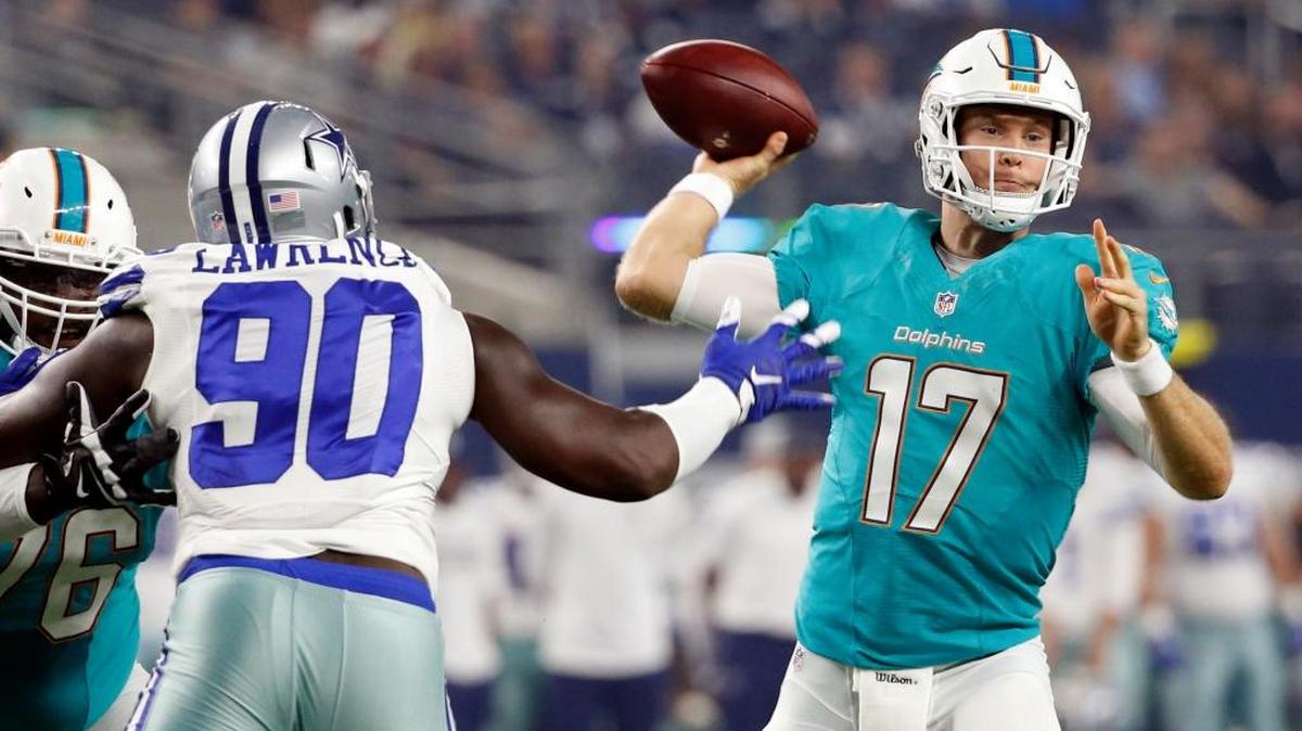 Dallas Cowboys defensive end Demarcus Lawrence (90) pressures Miami Dolphins quarterback Ryan Tannehill (17) in the first half of an NFL preseason football game Friday, Aug. 19, 2016, in Arlington, Texas.