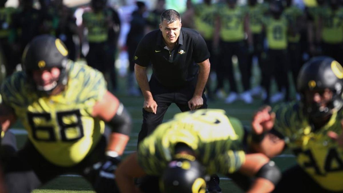 In this Oct. 28, 2017, file photo, Oregon co-offensive coordinator Mario Cristobal watches a special teams warmup drill before playing Utah, in Eugene, Oregon.