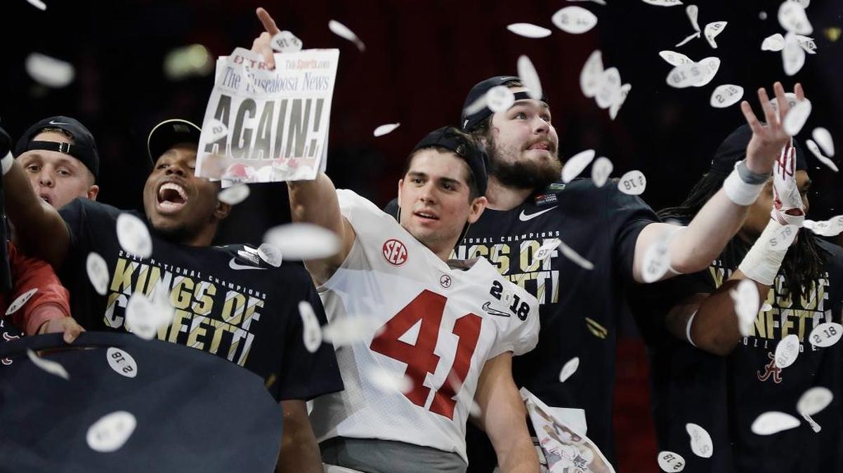 Alabama players celebrate after the Crimson Tide defeated Georgia 26-23 on Monday in Atlanta.