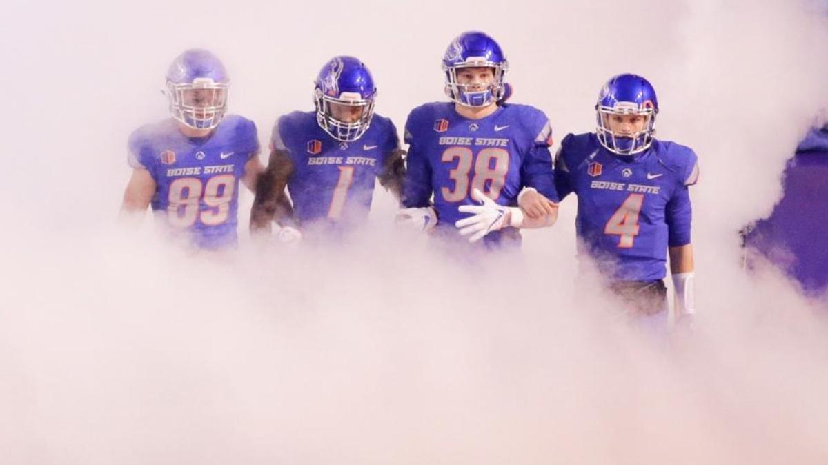 Boise State wide receiver Brock Barr (89), wide receiver Cedrick Wilson (1), linebacker Leighton Vander Esch (38) and quarterback Brett Rypien (4) lead the team onto the field last Saturday against Fresno State at Albertsons Stadium in Boise.