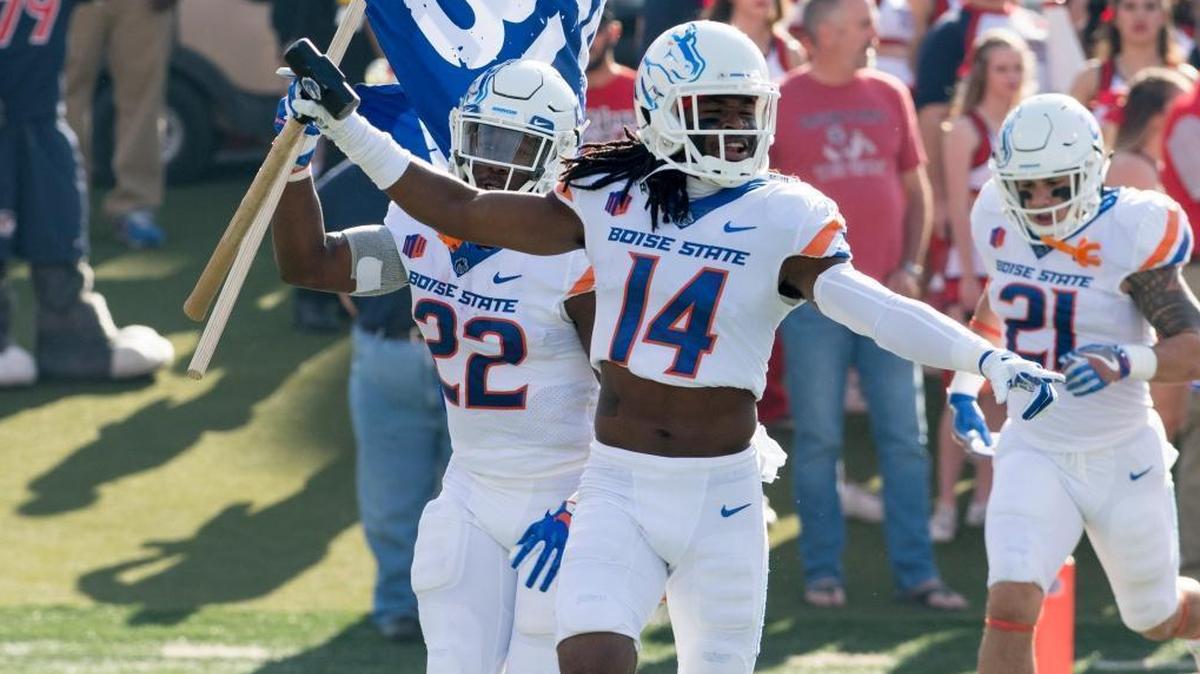 Boise State cornerback Tyler Horton (14) carried the Hammer as he returned home to Fresno.