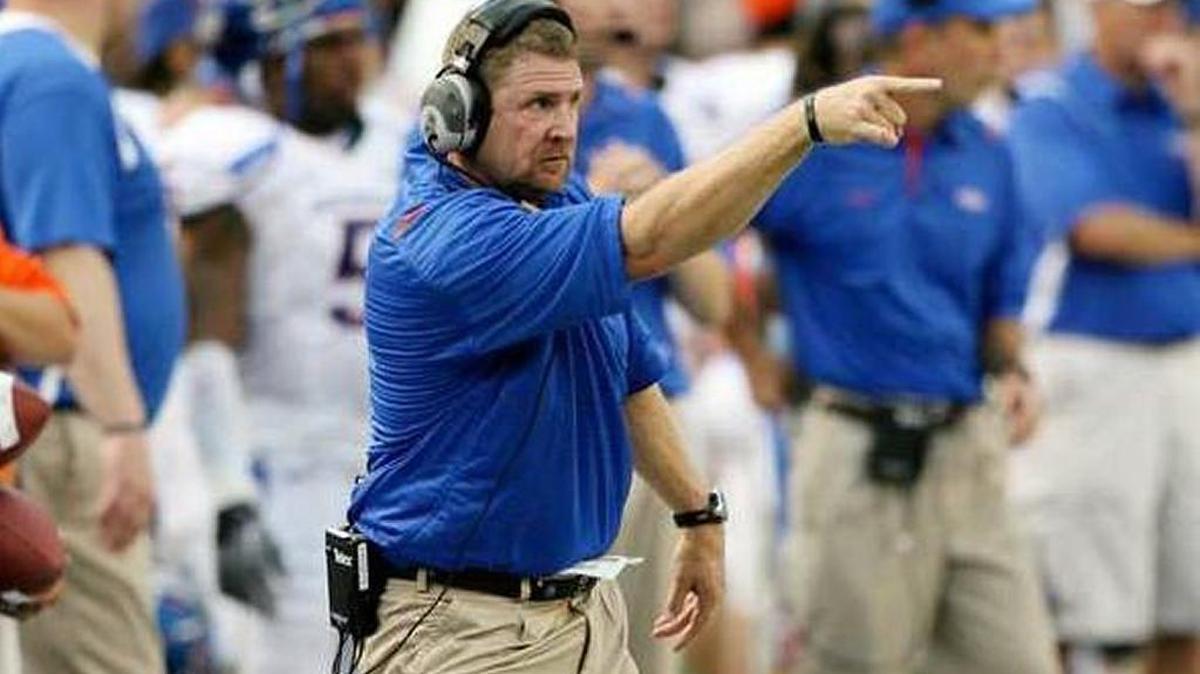 Former Boise State assistant coach Jeff Choate signals the Bronco defense against Hawaii on Oct. 24, 2009, in Honolulu.