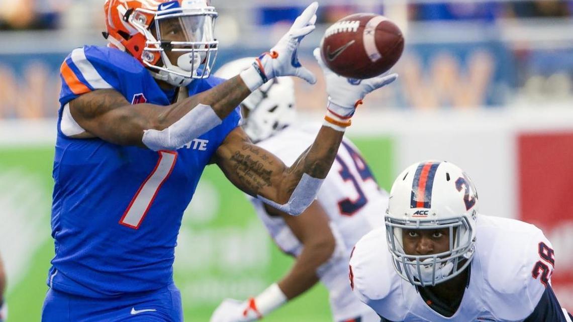 Boise State receiver Cedrick Wilson grabs a pass against Virginia. He had a career-high 13 receptions in the game for 209 yards.