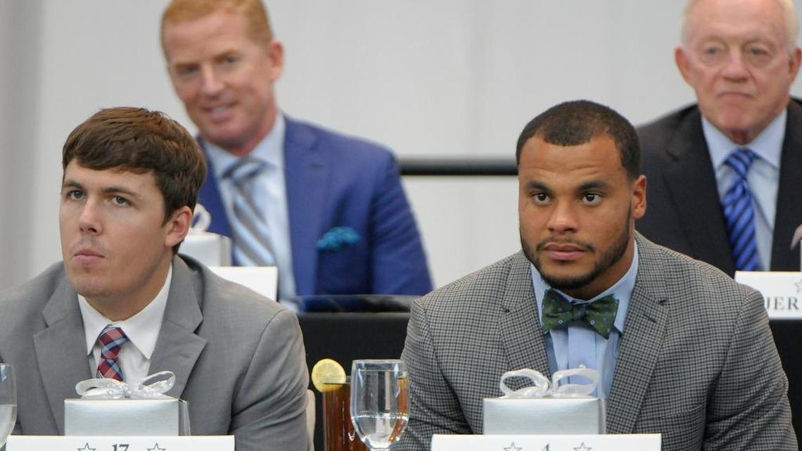 Dallas Cowboys quarterback Kellen Moore (17) and quarterback Dak Prescott (4) seated at the Cowboys annual kickoff luncheon at AT&T Stadium in Arlington, Texas, on Aug. 31, 2016. Coach Jason Garrett and owner Jerry Jones are seen behind them.