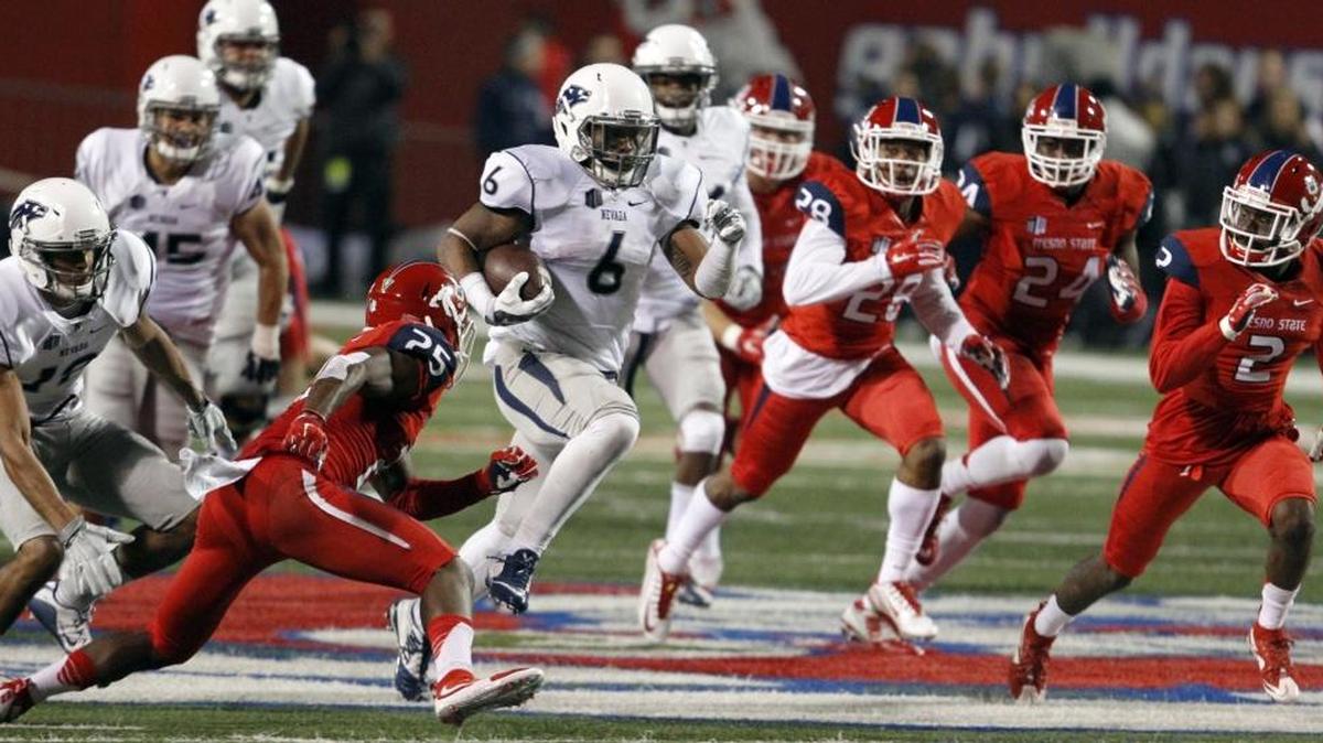 Nevada's Don Jackson (6) runs past Fresno State's Tyquwan Glass, left, during the second half of their Mountain West game Thursday, Nov. 5, 2015, in Fresno, Calif.