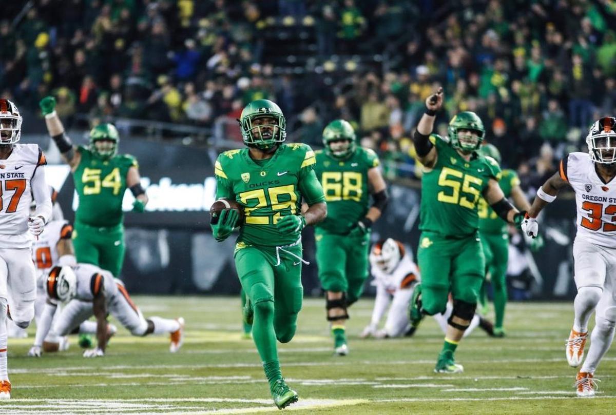 Oregon running back Kani Benoit scores a touchdown against Oregon State.