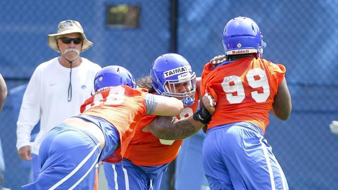 Boise State defensive line coach Steve Caldwell watches his group during the first day of practice for the Broncos on Aug. 6, 2015.