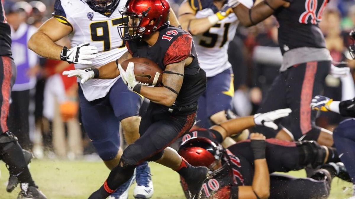 San Diego State running back Donnel Pumphrey tries to turn upfield against California late in the fourth quarter of their game Saturday, Sept. 10, 2016, in San Diego. San Diego won 45-40.