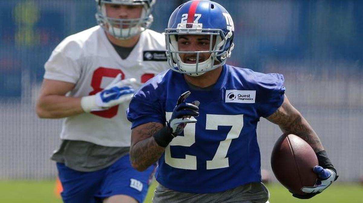 New York Giants safety Darian Thompson (27) runs back an interception as Matt LaCosse (81) chases him during practice at the New York Giants training facility in East Rutherford, N.J. on Wednesday.