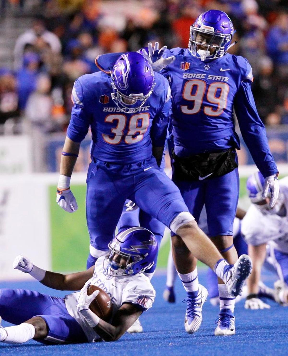 Boise State linebacker Leighton Vander Esch (38) steps over Air Force wide receiver Ronald Cleveland (3) after making a tackle last Saturday at Albertsons Stadium in Boise.