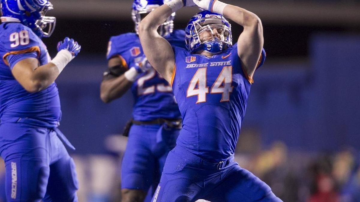 Boise State linebacker Darren Lee (44) celebrates after one of his team-high 11 tackles in a 42-25 victory against UNLV at Albertsons Stadium in Boise, Idaho, on Friday, Nov. 18, 2016.