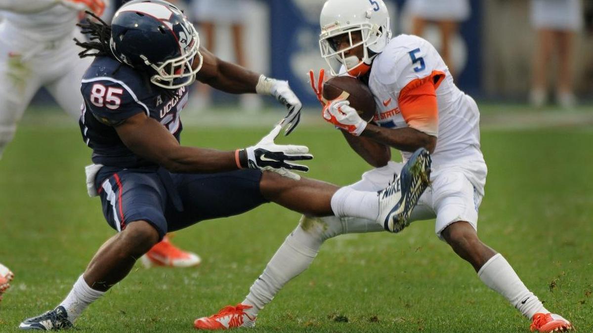 THE LAST TIME ... Boise State played as early as it will Saturday at UNLV was Sept. 13, 2014, when it had a noon local time (10 a.m. MT) kickoff at UConn. Donte Deayon, right, sealed the 38-21 victory when he stripped the ball from Geremy Davis for an interception and returned it 50 yards for a touchdown. The Broncos haven’t lost a regular-season game with an early kickoff since a 36-35 home defeat to TCU in 2011. That game started at 1:30 p.m.