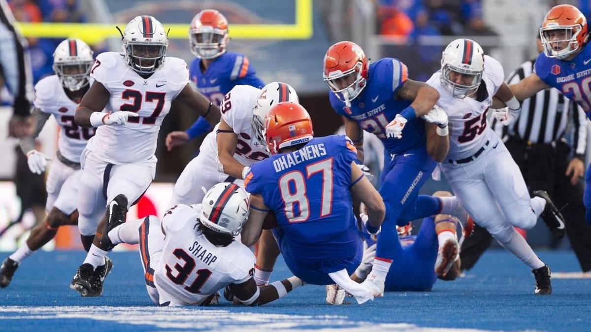 Boise State tight end Alec Dhaenens is taken down on a failed fake-punt attempt Sept. 22 against Virginia at Albertsons Stadium. It is one of the 14 times the Broncos have been stopped on 16 fourth-down attempts.