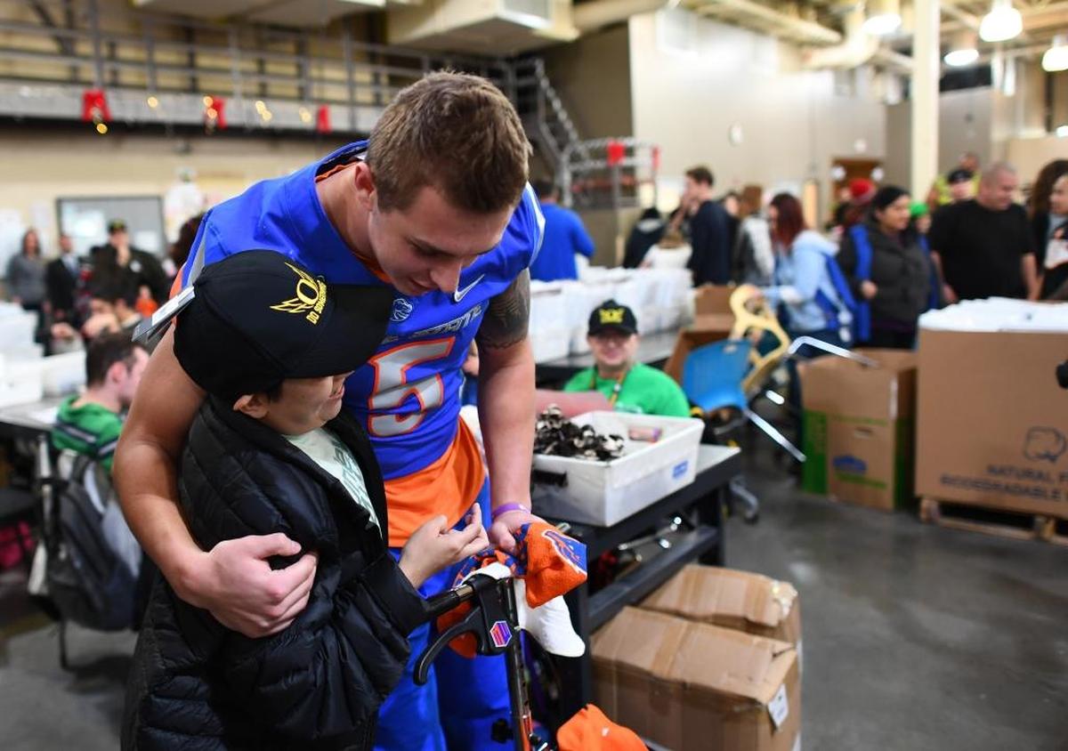 Boise State sophomore linebacker Garrett Collingham of Mountain View High was among the participants in the Opportunity Village visit Wednesday at the Las Vegas Bowl. Opportunity Village serves people with intellectual disabilities.