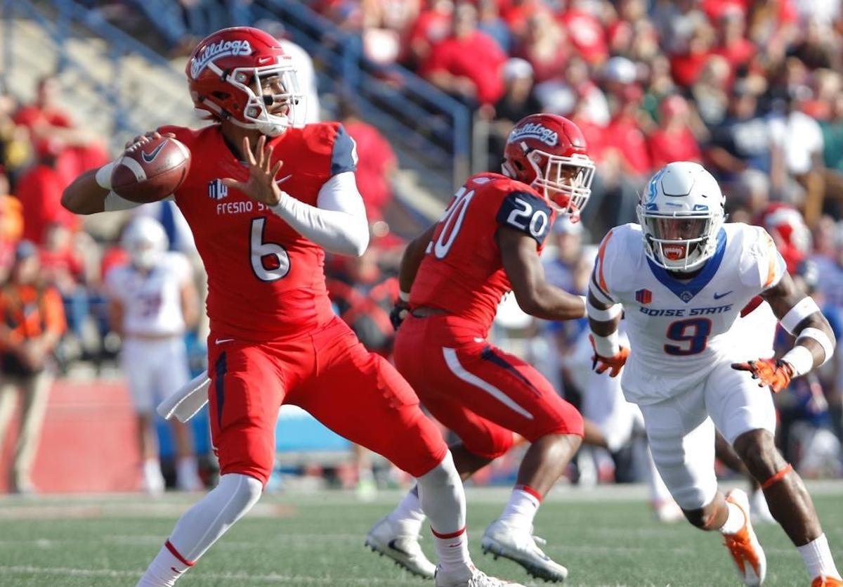 Fresno State quarterback Marcus McMaryion drops back to pass against Boise State linebacker Desmond Williams during the first half last week in Fresno, Calif.