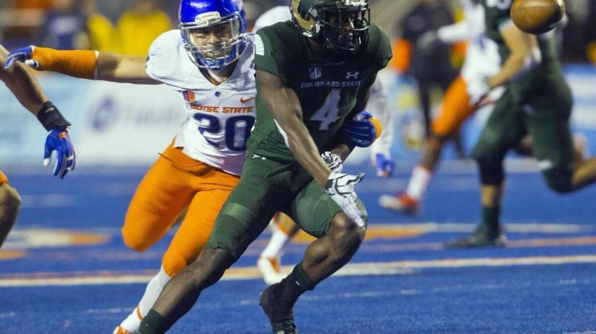 Colorado State wide receiver Michael Gallup laterals the football after a pass defended by Boise State linebacker Tanner Vallejo in the final seconds of the game Saturday,Oct. 15, 2016, at Albertsons Stadium.
