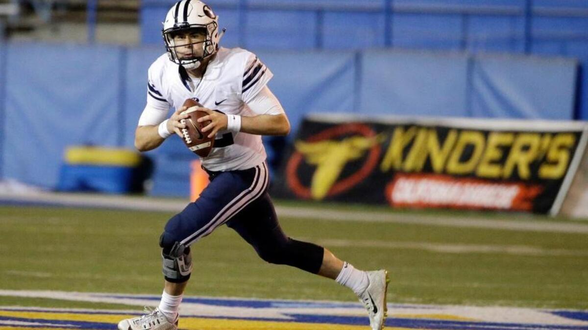 Boise State and BYU, including quarterback Tanner Mangum (Eagle High), above, are battling this month for a spot in the Las Vegas Bowl.