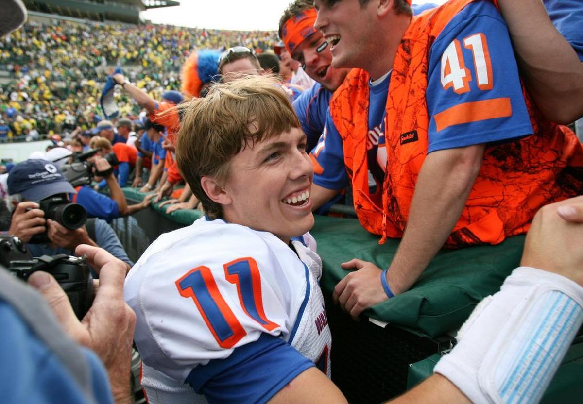 Boise State quarterback Kellen Moore celebrates with Bronco fans after beating Oregon at Autzen Stadium in Eugene in September 2008.