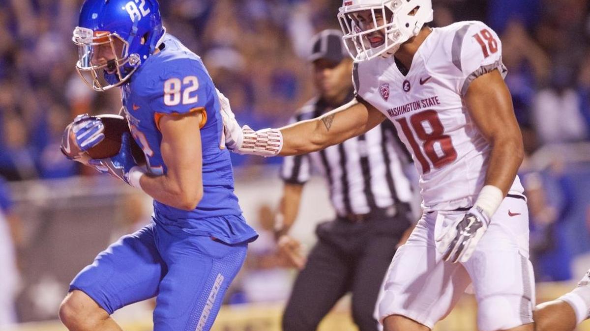 Boise State wide receiver Thomas Sperbeck (82) scores a touchdown against defense by Washington State safety Shalom Luani (18) on Sept. 10 at Albertsons Stadium.