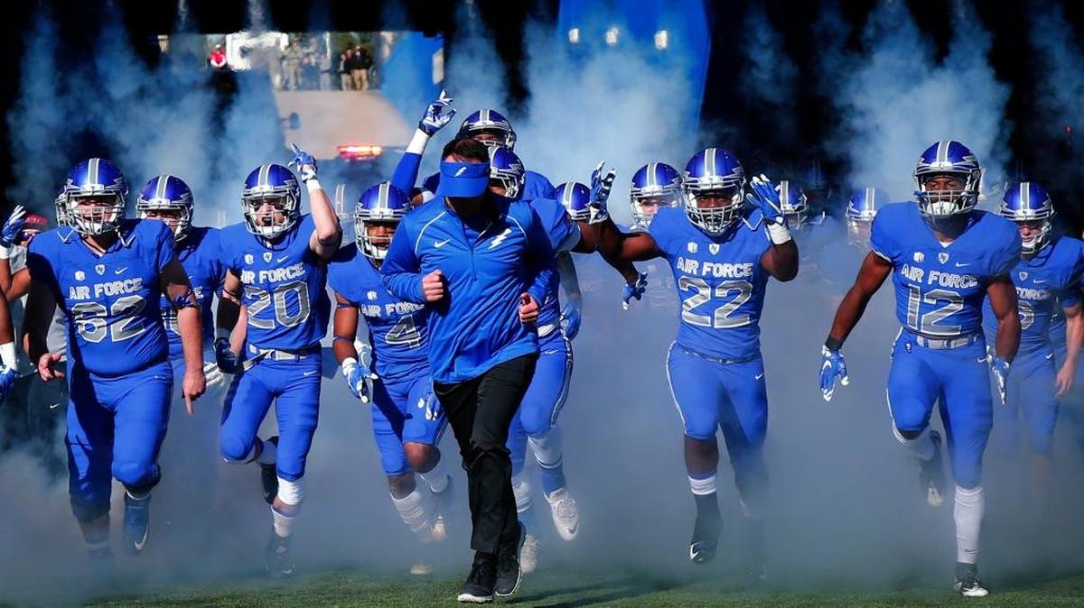Air Force coach Troy Calhoun brings his team onto the field for a game against Army at Air Force, Academy, Colo., on Saturday, Nov. 7, 2015. Air Force beat Army 20-3.