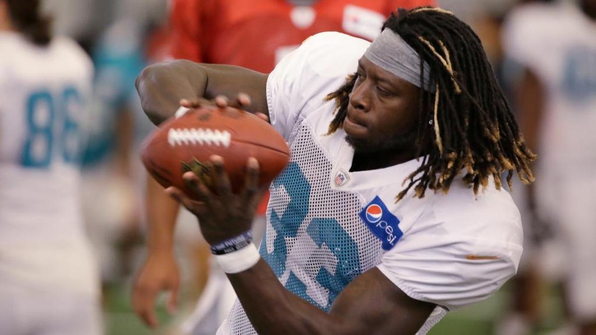 Miami running back Jay Ajayi runs through drills with the Dolphins.