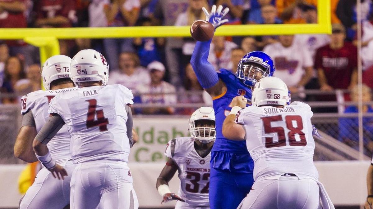 Boise State nose tackle David Moa (55) deflects a pass by Washington State quarterback Luke Falk (4) in the first quarter of the home opener at Albertsons Stadium on Saturday, Sept. 10, 2016 in Boise.