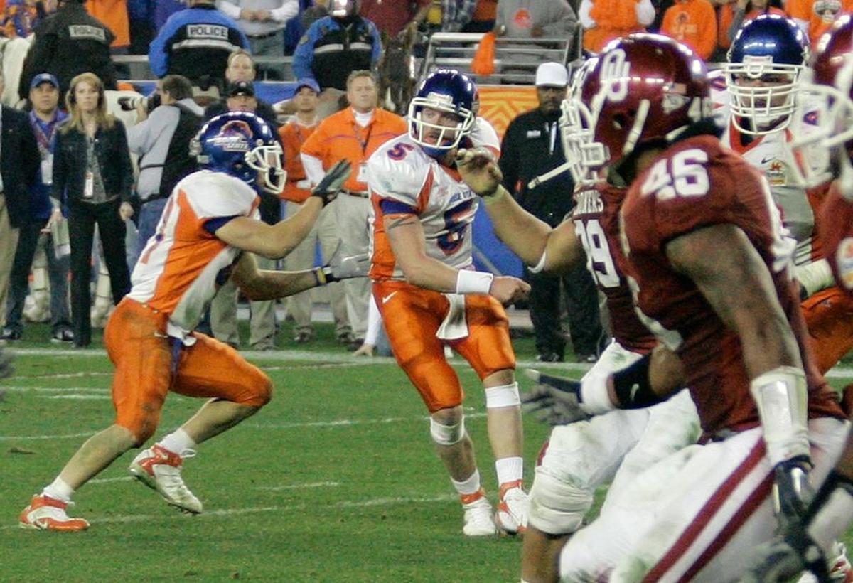 Boise State quarterback Jared Zabransky (5) hands the ball off behind his back to tailback Ian Johnson, who turned the Statue of Liberty play into a 43-42 overtime victory over Oklahoma on Monday, Jan. 1, 2007, in Glendale, Ariz.