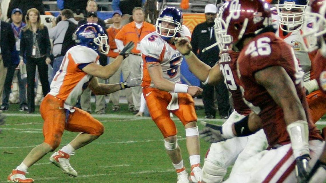 Boise State quarterback Jared Zabransky (5) hands the ball off behind his back to tailback Ian Johnson, who turned the Statue of Liberty play into a 43-42 overtime victory over Oklahoma on Monday, Jan. 1, 2007, in Glendale, Ariz.