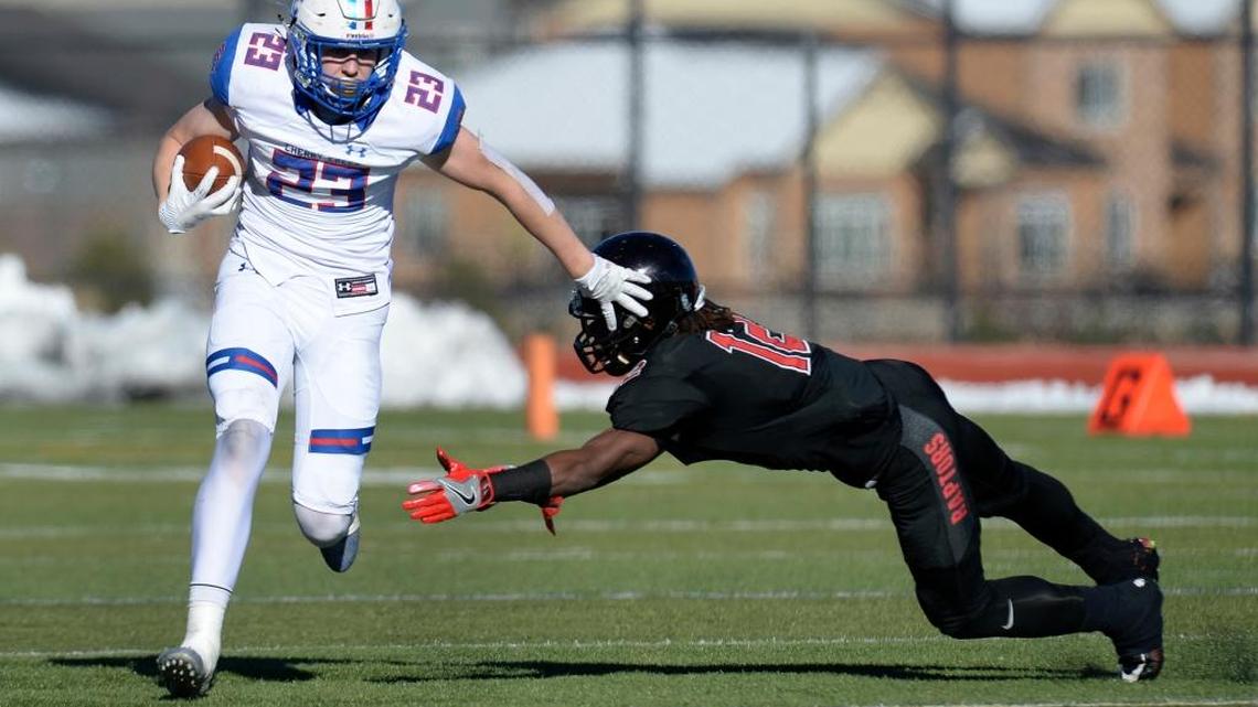 Cherry Creek’s Alec Pell (23) moves past Eaglecrest’s Victor Garnes (12) in the 5A quarterfinals at Legacy Stadium on Nov. 18, 2017 in Aurora, Colo.