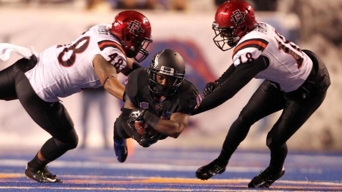 Boise State wide receiver Shane Williams-Rhodes dives for a first down in the fourth quarter against San Diego State on Nov. 15, 2014, at Albertsons Stadium in the teams’ last meeting.