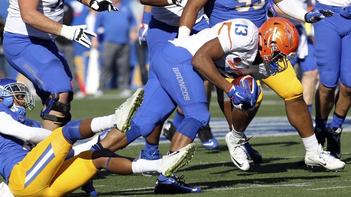 Boise State running back Jeremy McNichols (13) is brought down by San Jose State safety Maurice McKnight (10) at Spartan Stadium in San Jose, Calif., on Nov. 27.