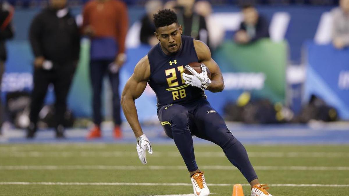 Jeremy McNichols, shown during a drill at the NFL scouting combine, said it wasn’t surprising being taken by the Bucs, who are coached by former BSU coach Dirk Koetter.