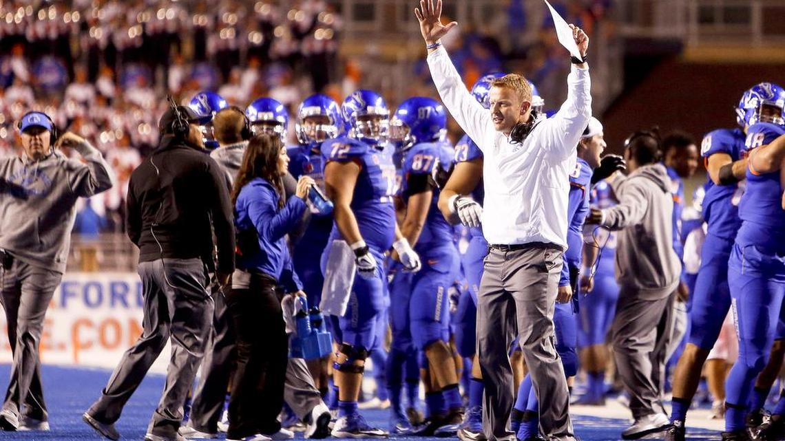 Boise State head coach Bryan Harsin celebrates in the first half against Wyoming at Albertsons Stadium on Saturday Oct. 24, 2015.