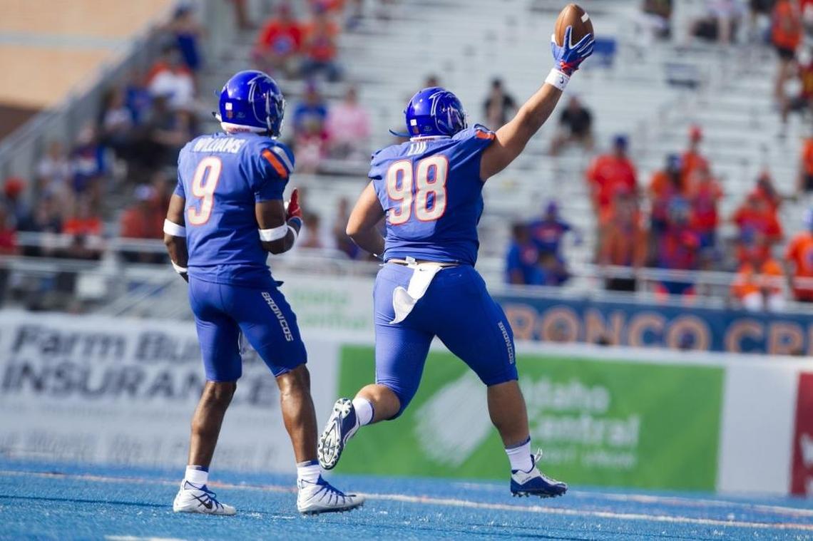 Boise State nose tackle Sonatane Lui (98) celebrates a fumble recovery late in the fourth quarter of the season opener against Troy. Lui is a starter less than two years after returning from his LDS mission.
