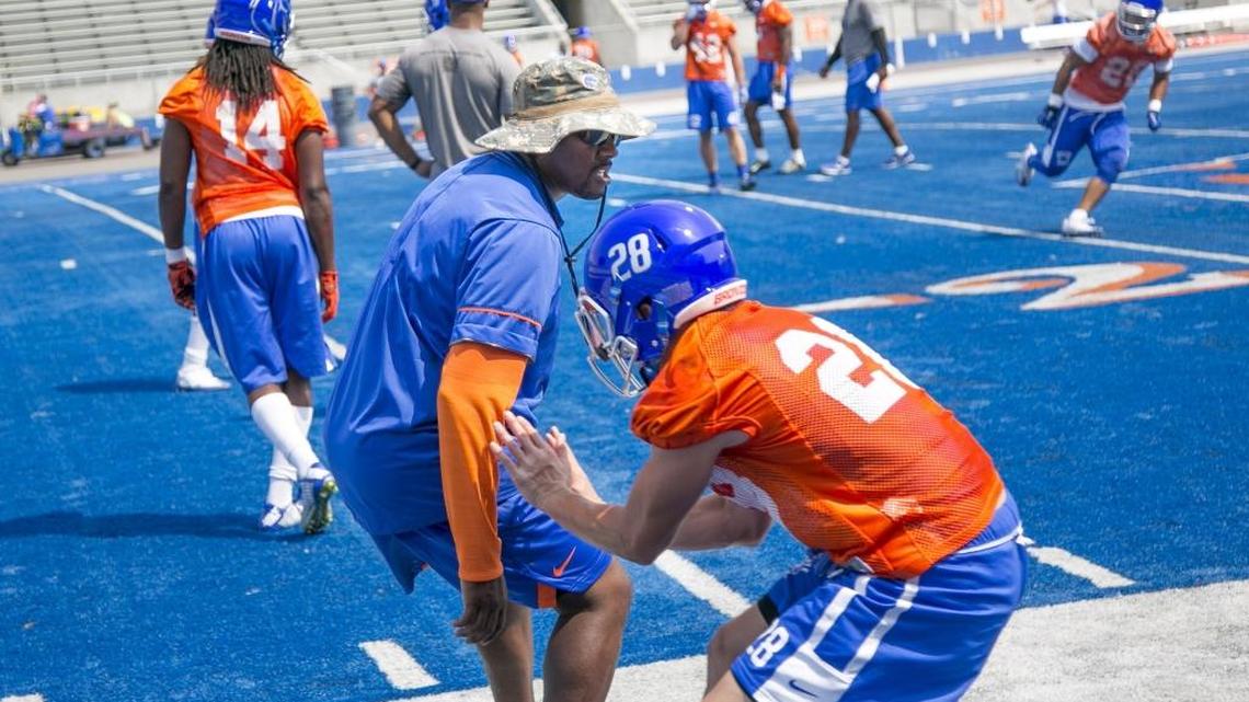 Boise State safeties coach Gabe Franklin instructs players during practice at Albertsons Stadium.