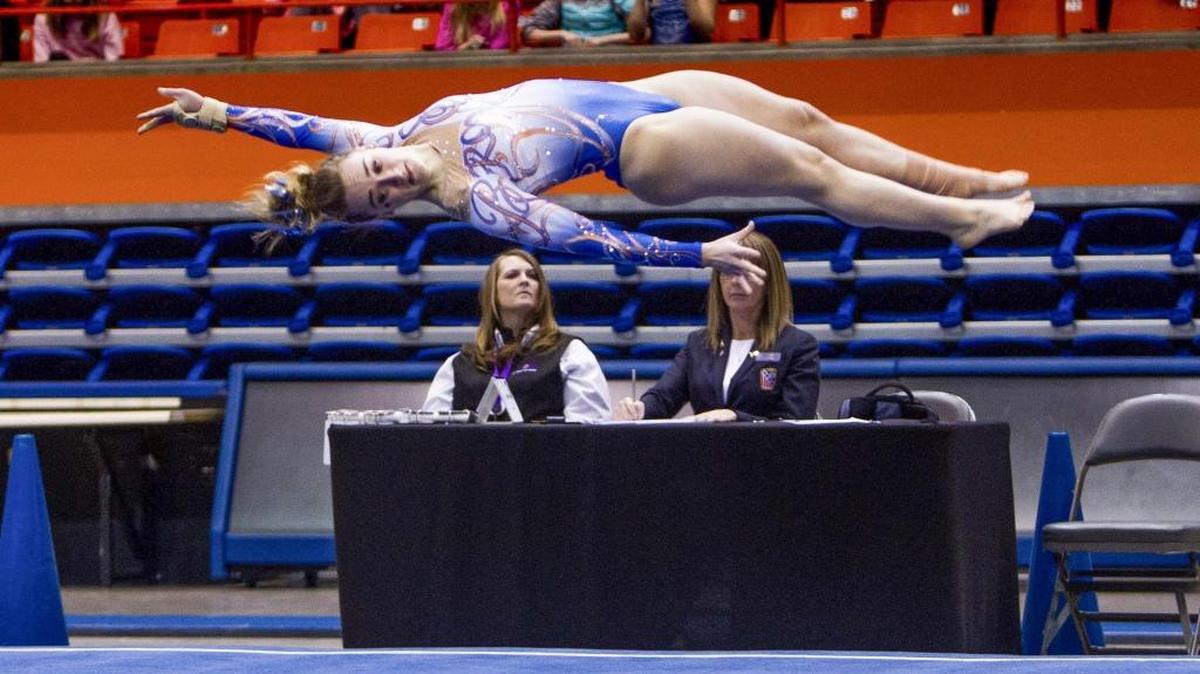 Boise State’s Shani Remme rotates out of flip during her floor routine Friday at Taco Bell Arena. She had BSU’s top score on the floor and the beam.