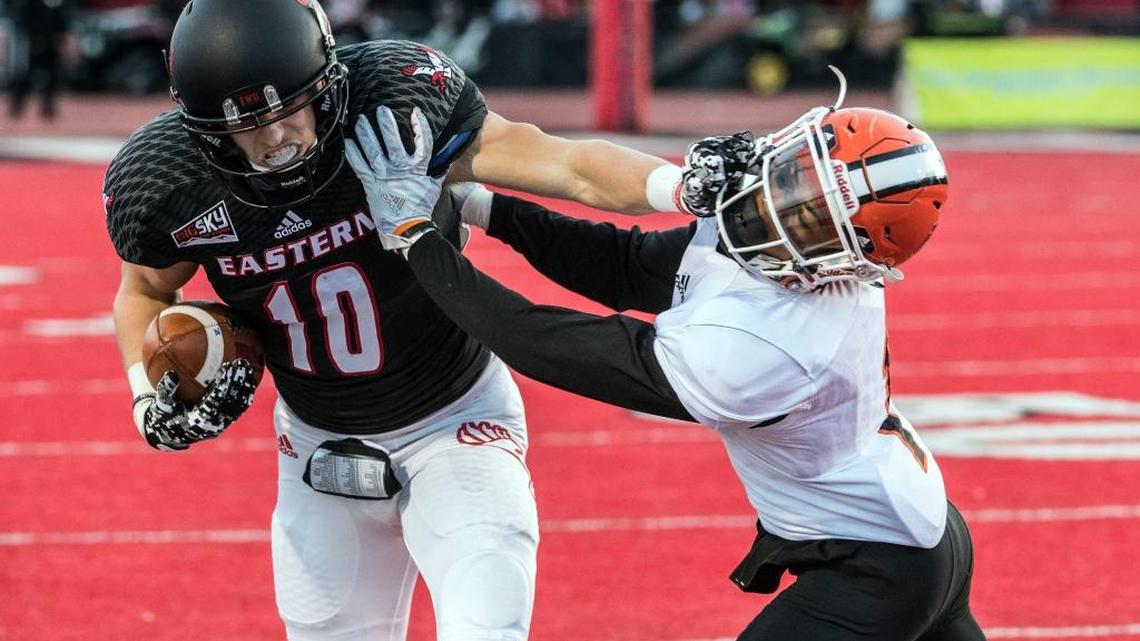 Former Eastern Washington wide receiver Cooper Kupp fights for yards against Idaho State defensive back Anthony Ricks during their college football game Saturday, Nov. 12, 2016, in Cheney, Wash.