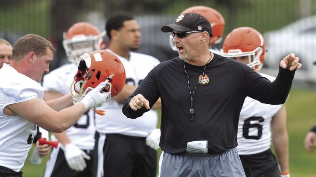 Idaho State football coach Rob Phenicie directs his team during a spring practice this season.