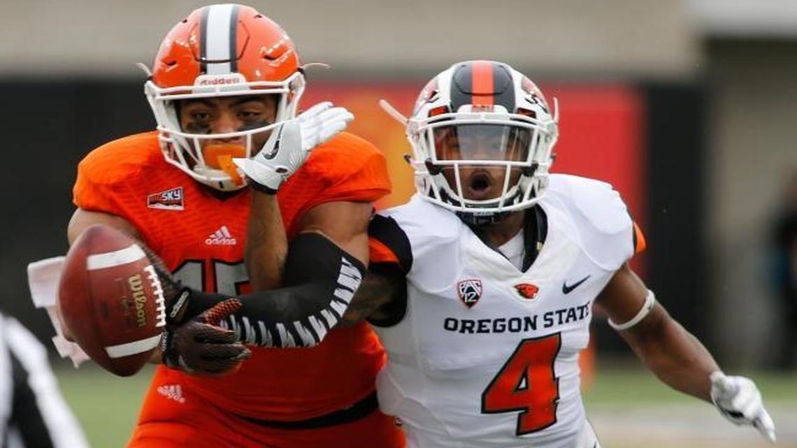 Idaho State wide receiver KW Williams, center, has a pass knocked away by Oregon State cornerback Dwayne Williams last season in Corvallis, Ore. Idaho State has played two money games against FBS opponents every year since Jeff Tingey became the Bengals’ athletic director in 2009.