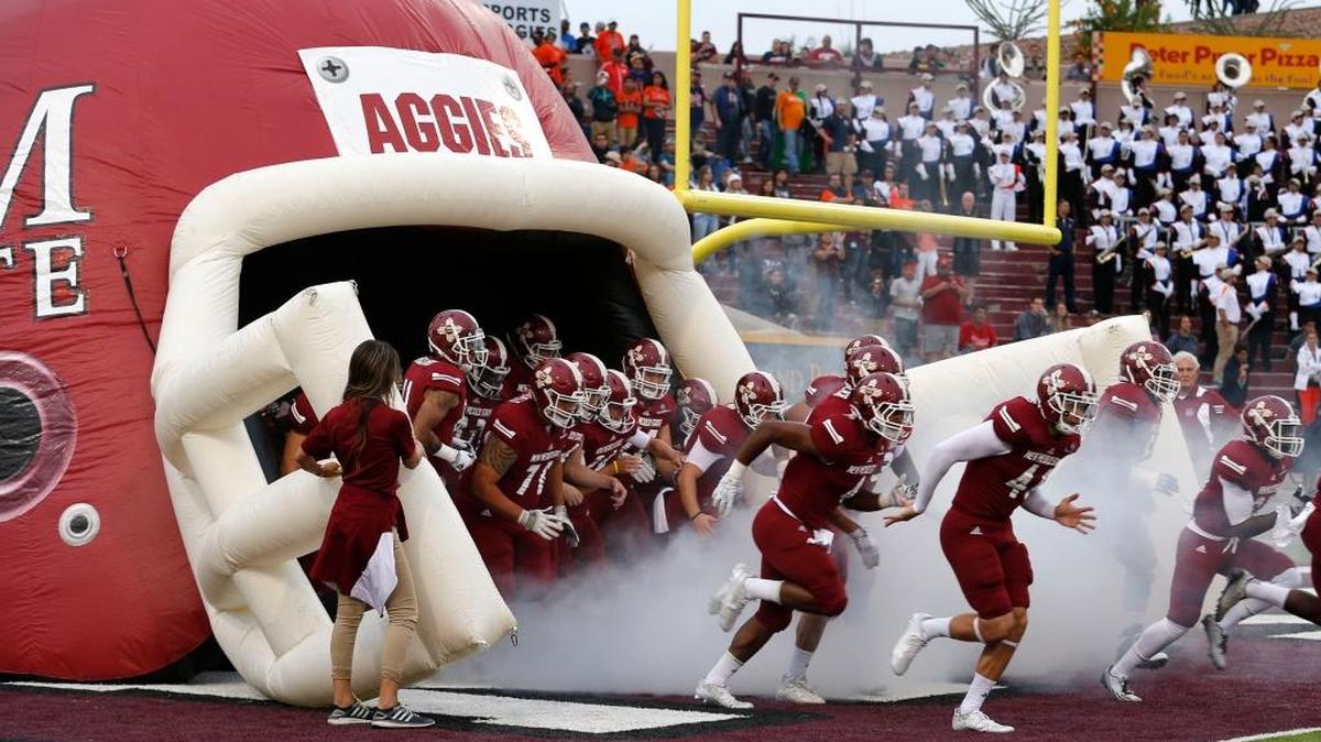 New Mexico State players take the field to face UTEP on Sept. 19, 2015, in Las Cruces, N.M.