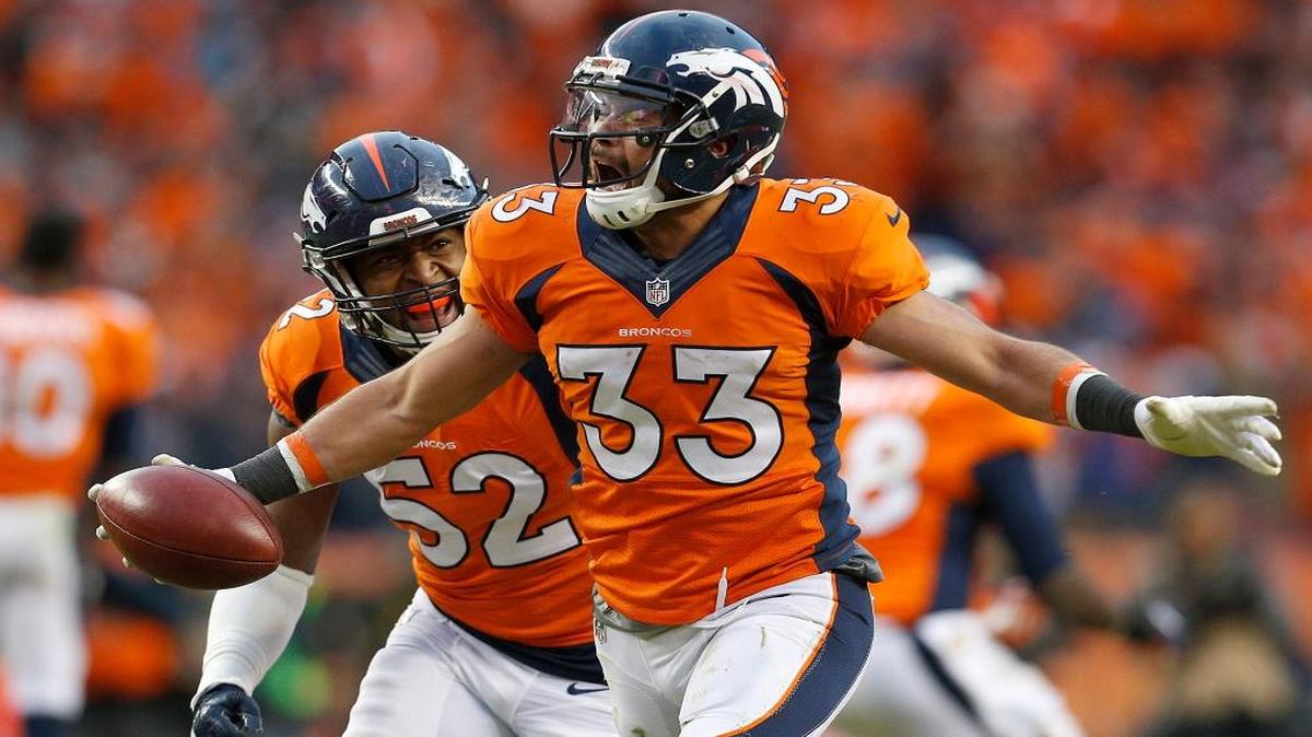 Denver Broncos defensive back Shiloh Keo (33) celebrates with Corey Nelson following the AFC Championship game between the Denver Broncos and the New England Patriots, Sunday, Jan. 24, 2016, in Denver. The Broncos defeated the Patriots 20-18 to advance to the Super Bowl.