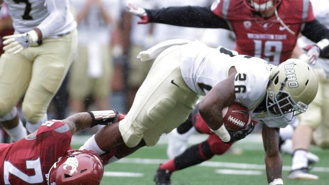 Washington State safety Hunter Dale, left, brings down Idaho wide receiver Reuben Mwehla during the second half of their college football game in Pullman, Wash., on Saturday, Sept. 17, 2016. Washington State won 56-6.