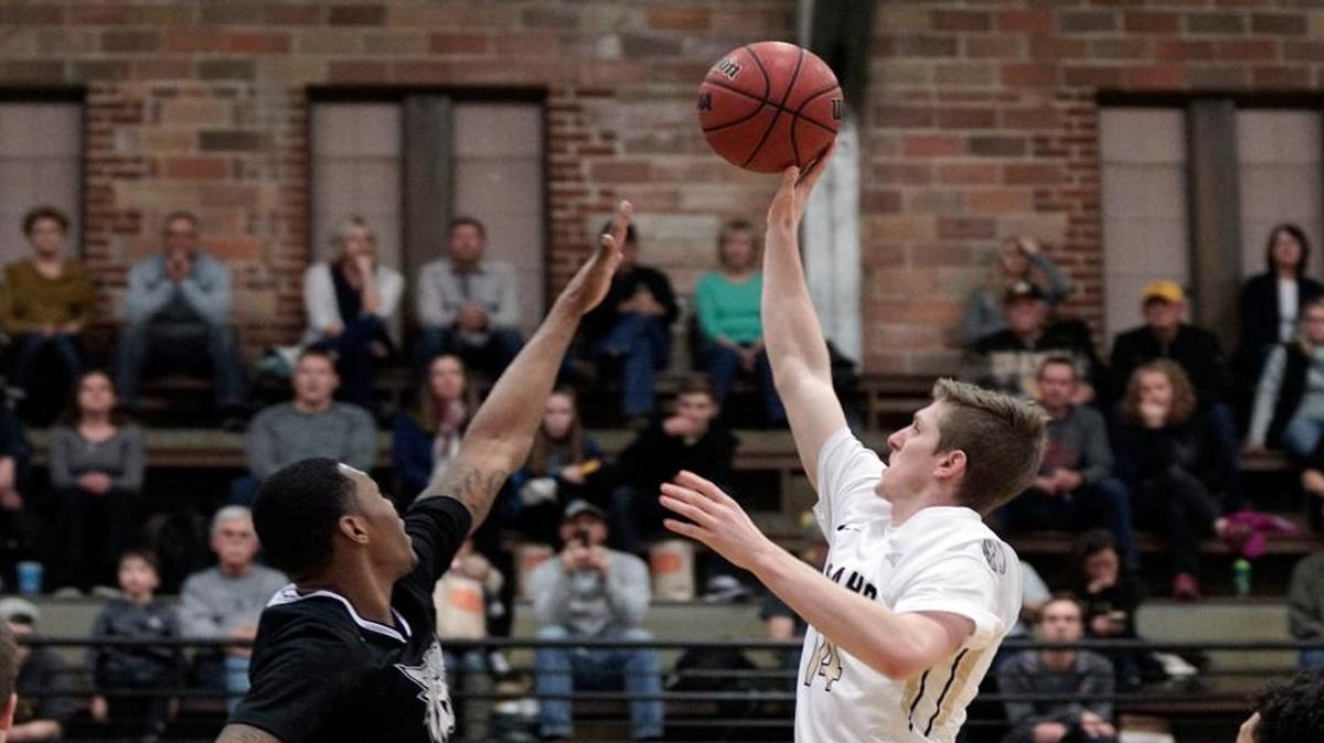 Idaho’s Chad Sherwood, right, shoots over Weber State’s Kyndahl Hill during the second half Saturday in Moscow.