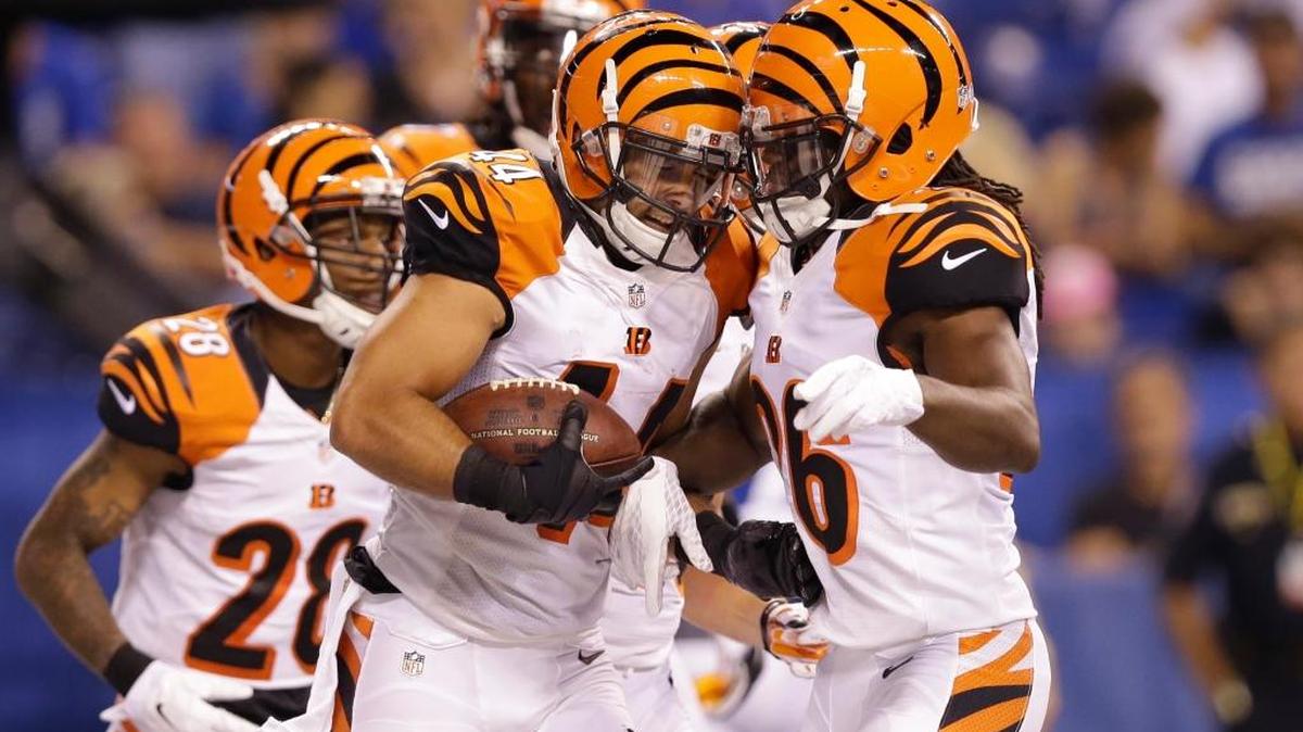 Cincinnati’s Shiloh Keo (44) and Josh Shaw (26) celebrate after Keo made an interception during the second half of a preseason game against the Colts on Sept. 3 in Indianapolis.