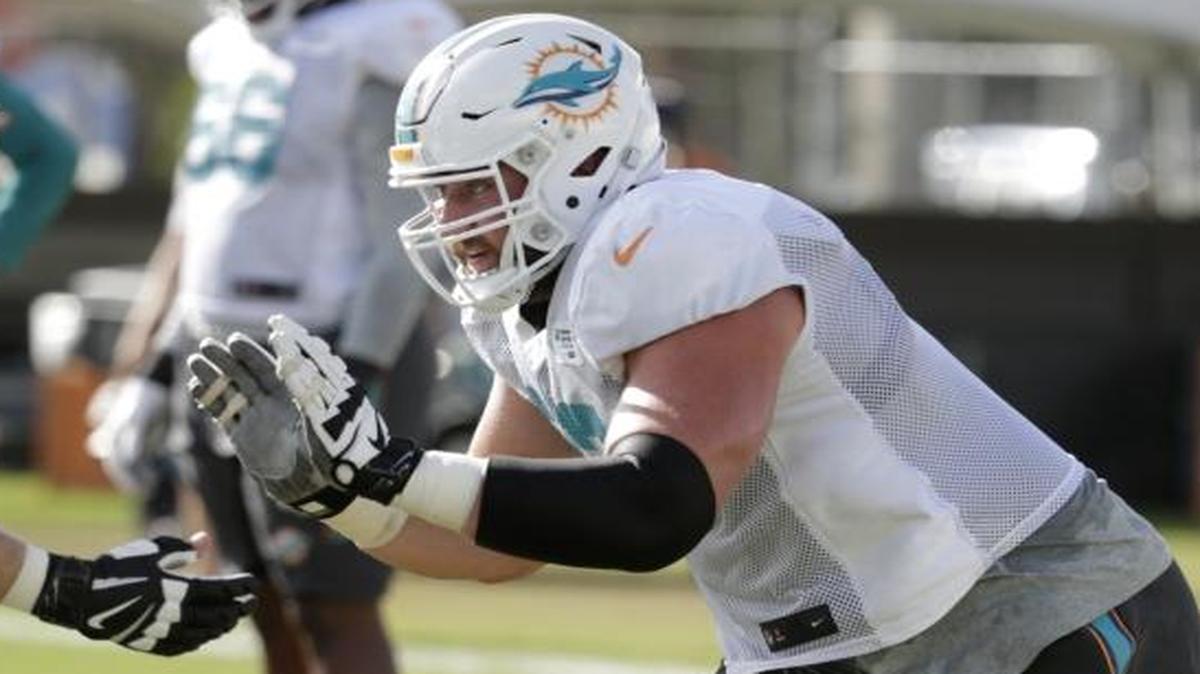 Miami Dolphins offensive lineman Jesse Davis runs through a drill during training camp Aug. 7 in Davie, Fla.