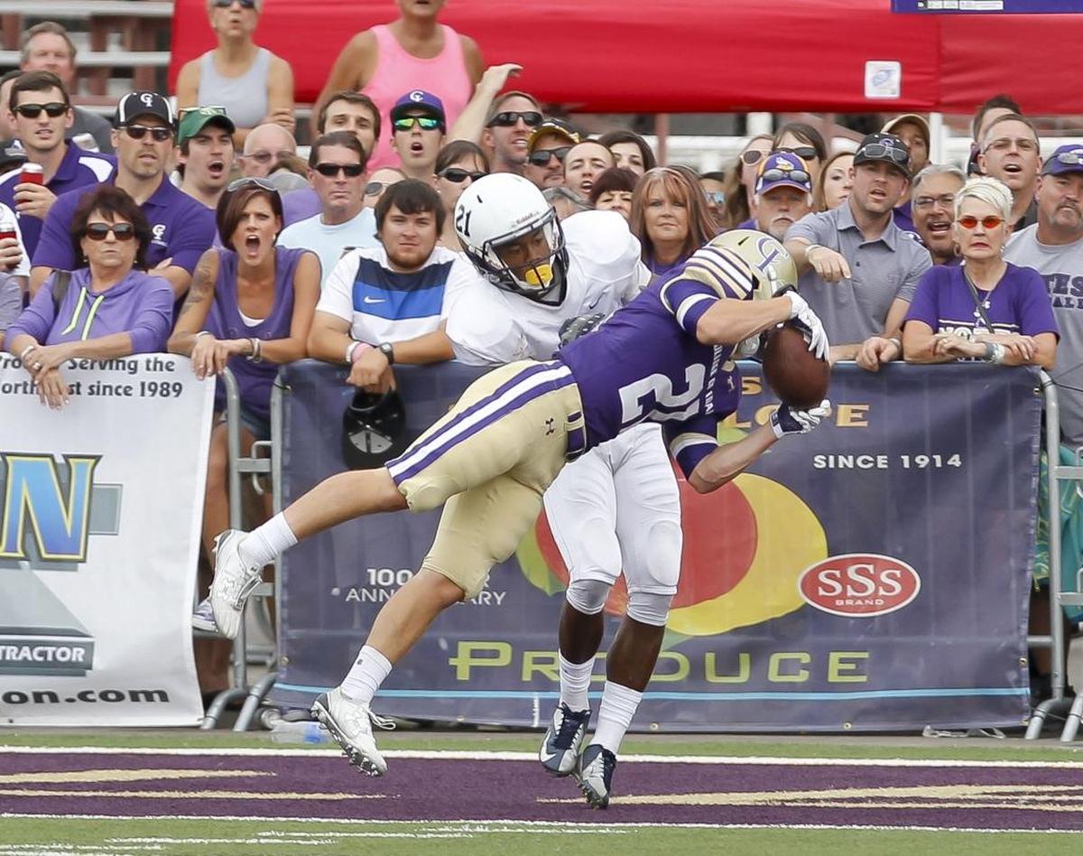 College of Idaho defensive back Nate Moore picks off a pass in the end zone in 2015 at Caldwell’s Simplot Stadium.